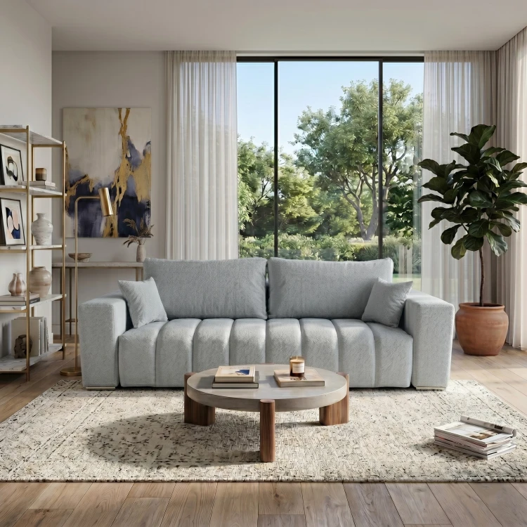 Szara sofa z funkcją spania CORA w aranżacji jasnego salonu